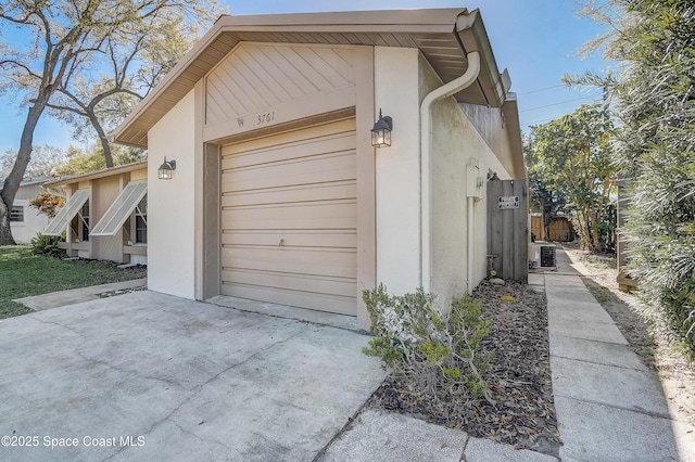 garage featuring driveway