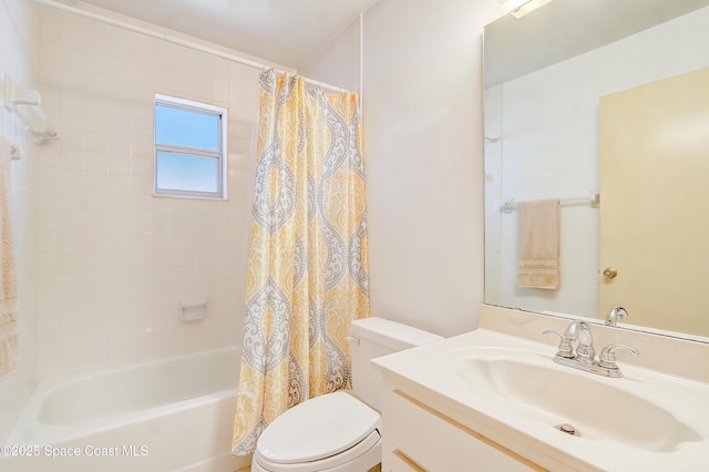 bathroom featuring toilet, shower / bath combo, and vanity