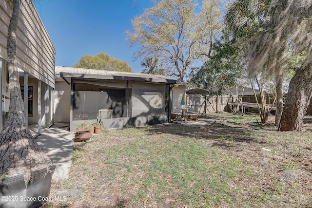 view of yard featuring a patio area and fence