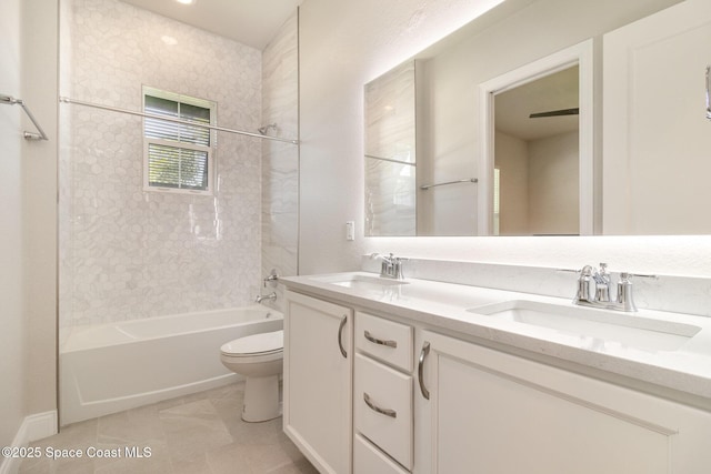 full bath featuring a sink, toilet, shower / washtub combination, and double vanity