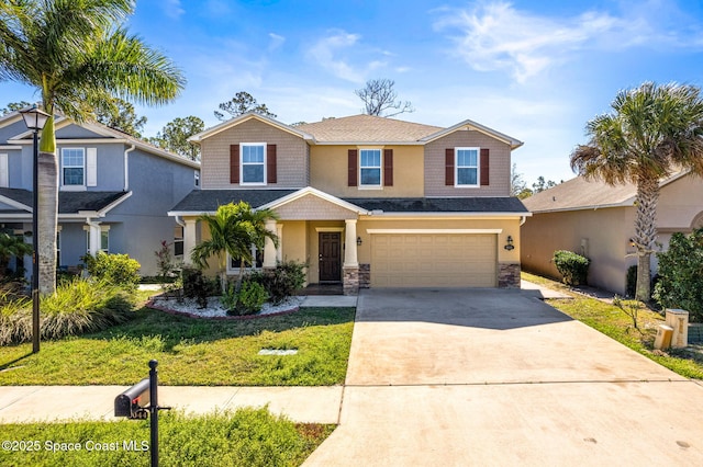 view of front facade featuring stucco siding, a front yard, a garage, stone siding, and driveway