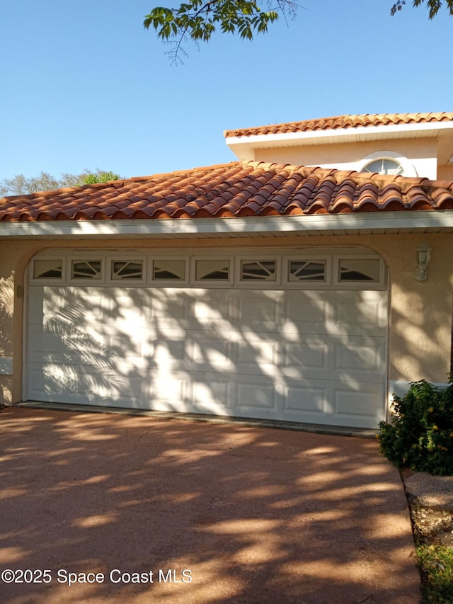 garage featuring driveway