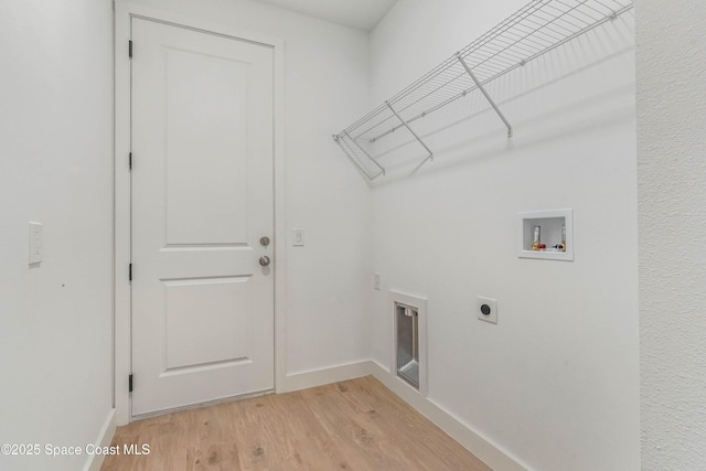 washroom featuring laundry area, baseboards, light wood-type flooring, washer hookup, and electric dryer hookup