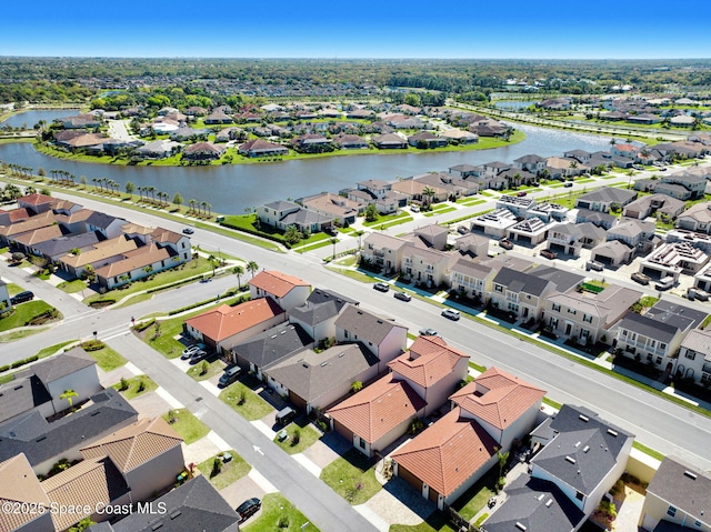 aerial view with a residential view and a water view