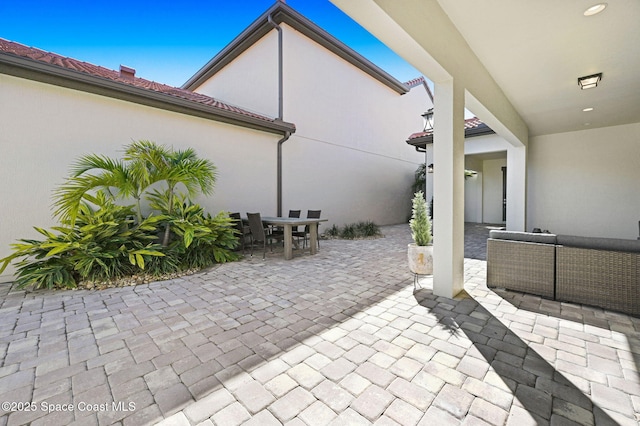 view of patio / terrace with an outdoor living space and outdoor dining area
