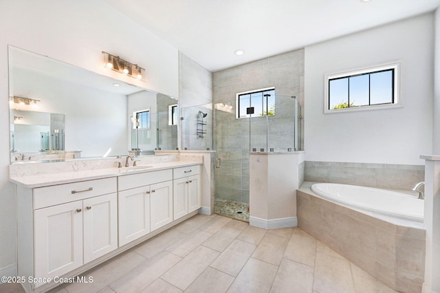 full bathroom with tile patterned floors, a garden tub, recessed lighting, a shower stall, and vanity