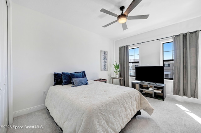 bedroom featuring carpet flooring, a ceiling fan, and baseboards