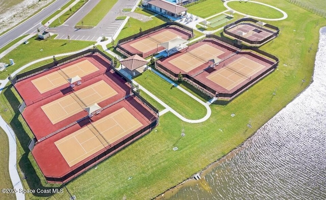 birds eye view of property with a water view