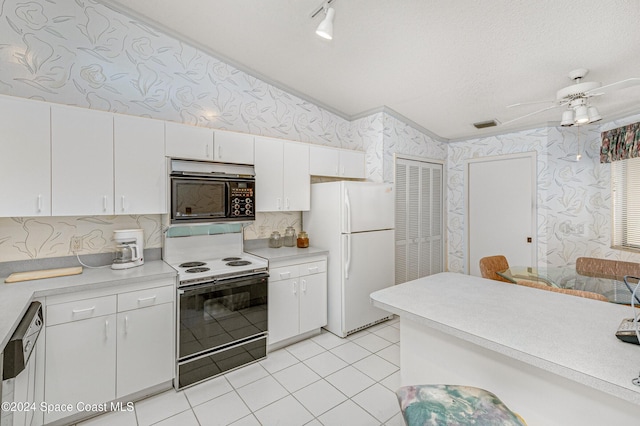 kitchen featuring wallpapered walls, electric range, dishwasher, freestanding refrigerator, and black microwave