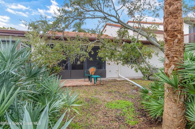 view of yard featuring a sunroom