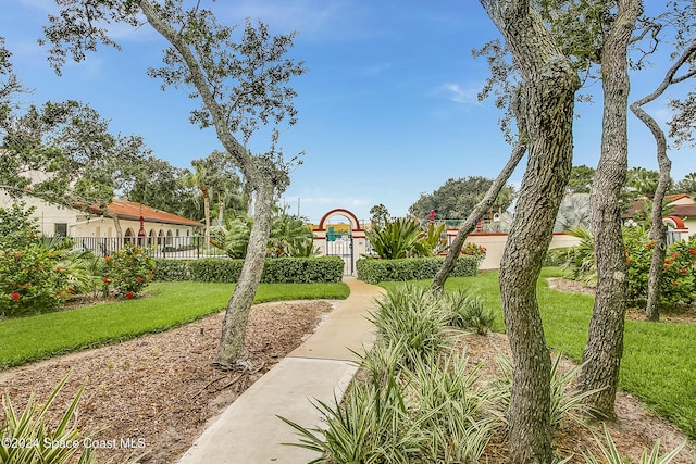 view of property's community featuring fence