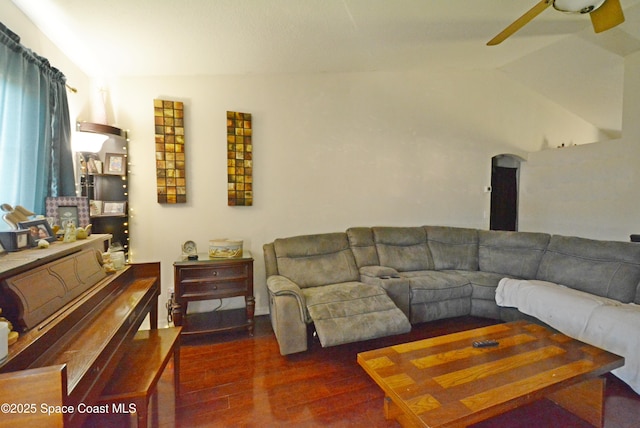 living room featuring lofted ceiling, ceiling fan, and wood finished floors