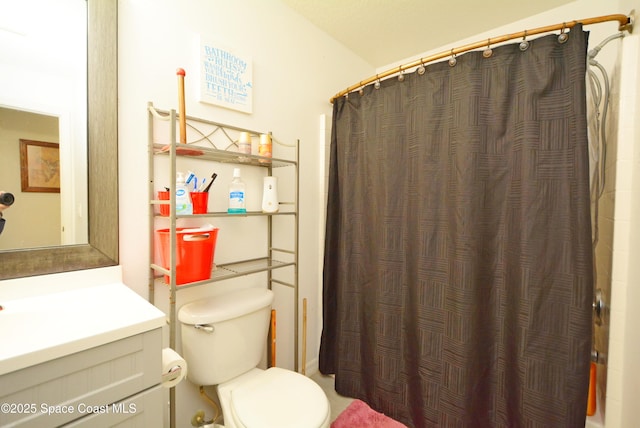 full bathroom featuring toilet, vanity, and a shower with shower curtain