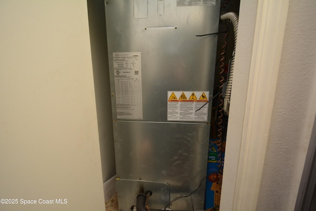 utility room featuring heating unit