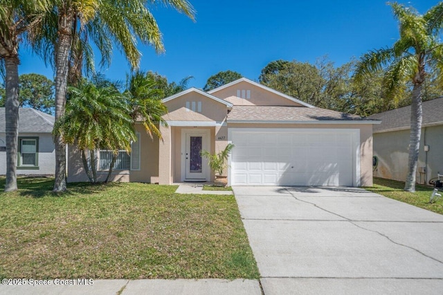 single story home featuring a front yard, driveway, an attached garage, and stucco siding