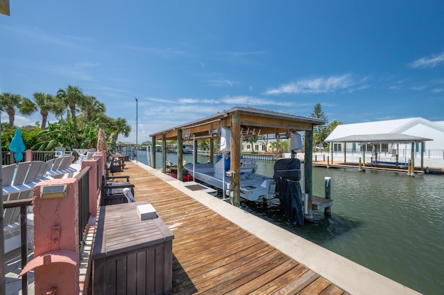 view of dock featuring a water view and boat lift