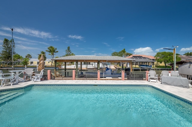 pool with fence and a gazebo