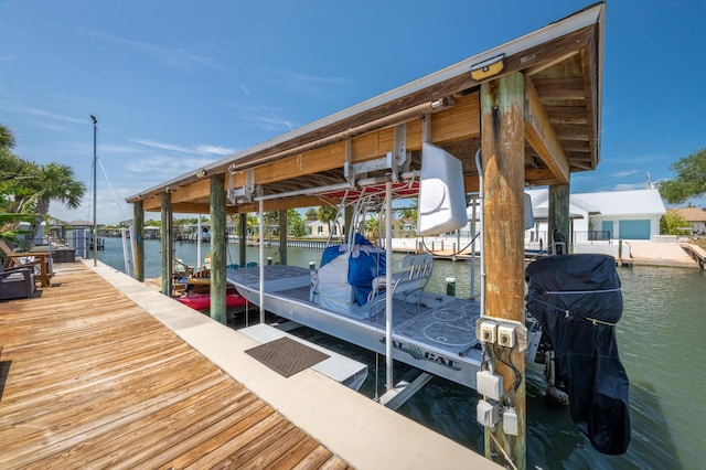 dock area featuring a water view and boat lift