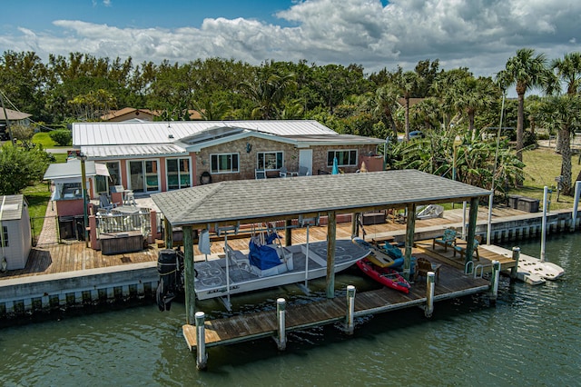 dock area featuring a water view and boat lift