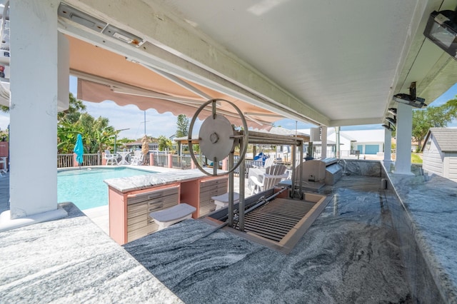 view of patio featuring a fenced in pool