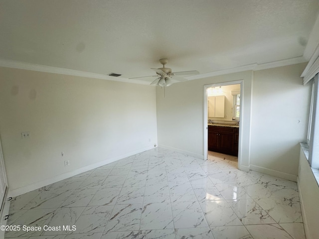 unfurnished bedroom featuring visible vents, baseboards, a ceiling fan, marble finish floor, and crown molding