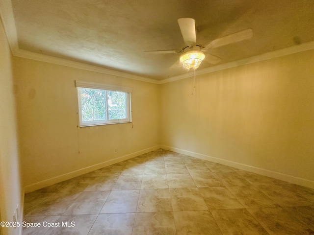 spare room featuring light tile patterned floors, ceiling fan, baseboards, and crown molding