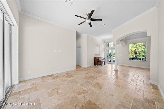 unfurnished living room featuring arched walkways, stone tile floors, ornate columns, a ceiling fan, and baseboards