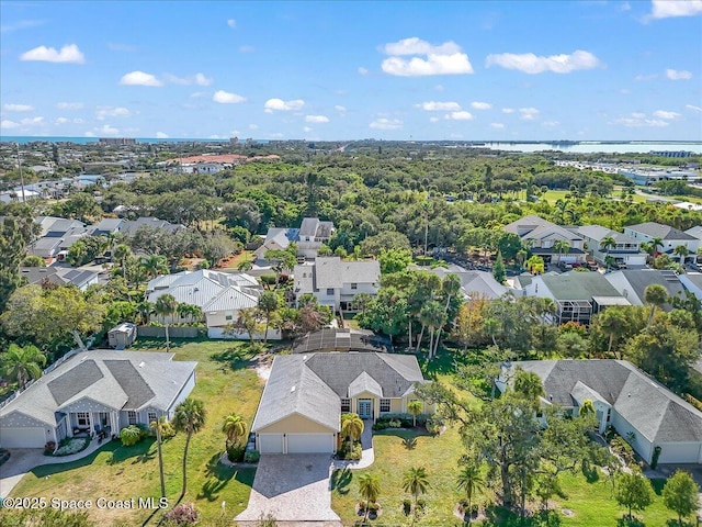 aerial view with a residential view and a water view