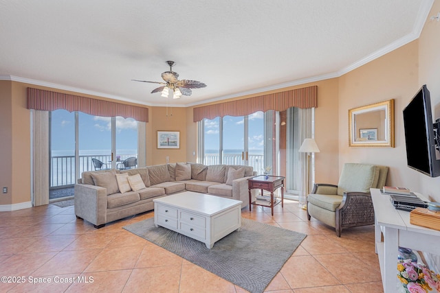 living area featuring light tile patterned floors, ornamental molding, and plenty of natural light