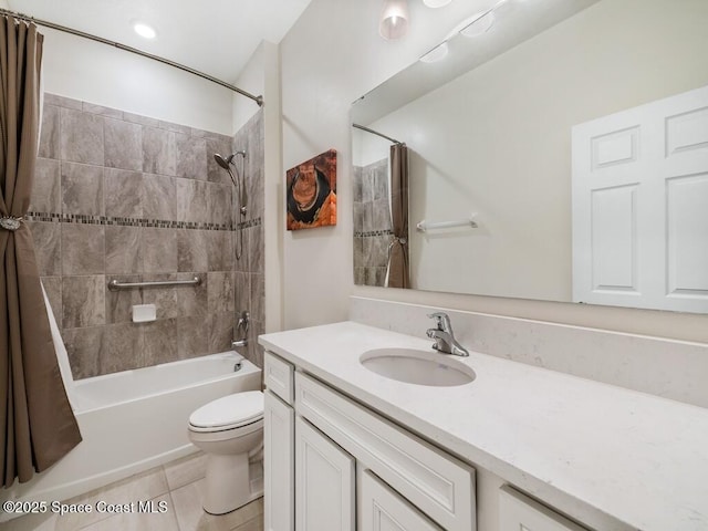 bathroom with shower / tub combo with curtain, vanity, toilet, and tile patterned floors