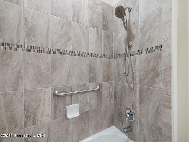 interior details featuring shower / bathing tub combination