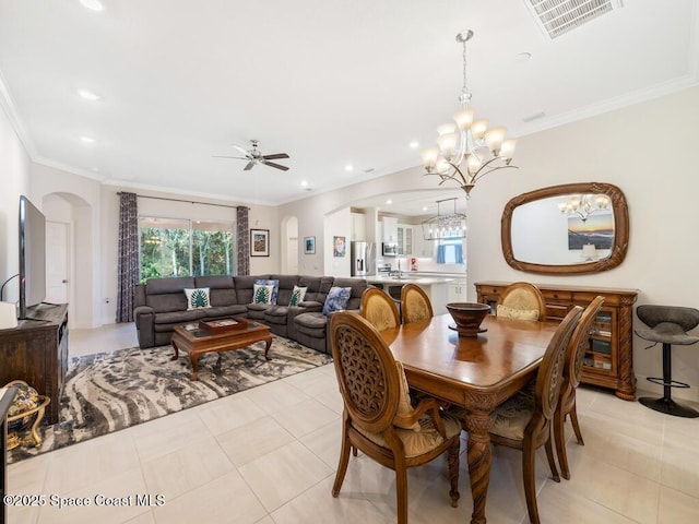 dining area featuring recessed lighting, visible vents, arched walkways, and ornamental molding