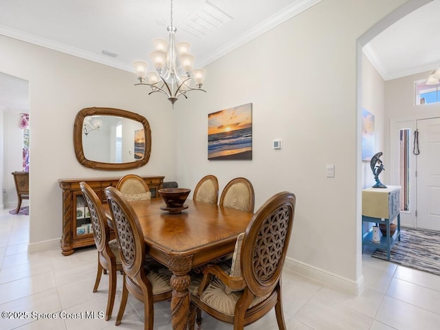 dining room with light tile patterned floors, baseboards, a chandelier, and crown molding