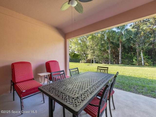 view of patio / terrace with a ceiling fan and outdoor dining space