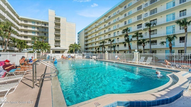 community pool featuring fence