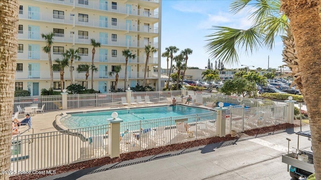 community pool featuring fence