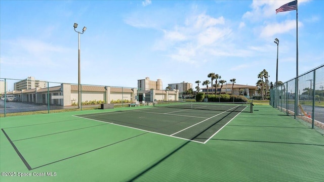 view of sport court with fence