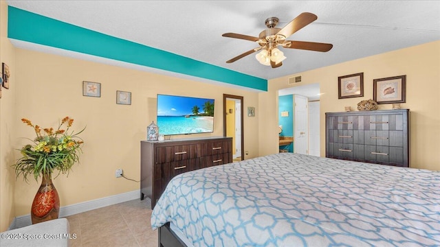 bedroom with ceiling fan, tile patterned flooring, visible vents, and baseboards