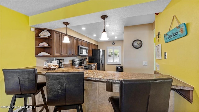 kitchen featuring range with electric cooktop, stainless steel microwave, freestanding refrigerator, a peninsula, and open shelves