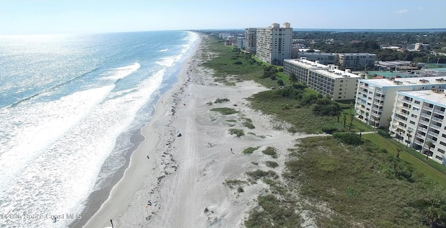 aerial view with a view of city, a water view, and a beach view