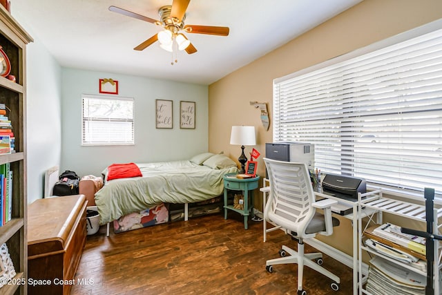 bedroom featuring a ceiling fan and wood finished floors