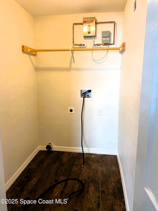washroom featuring hookup for an electric dryer, laundry area, baseboards, dark wood-style floors, and hookup for a washing machine