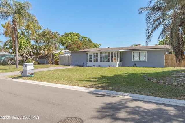 718 6th St, Merritt Island, FL 32953 - ranch-style home with stucco siding