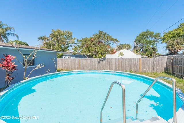 718 6th St, Merritt Island, FL 32953 - view of swimming pool featuring a fenced backyard