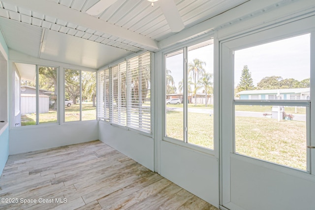 718 6th St, Merritt Island, FL 32953 - unfurnished sunroom with plenty of natural light, beam ceiling, and ceiling fan