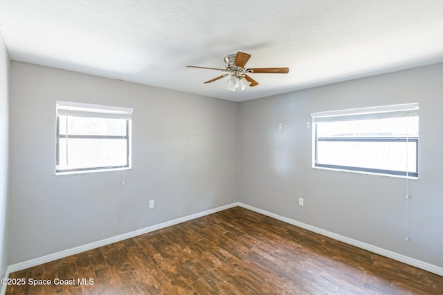 718 6th St, Merritt Island, FL 32953 - empty room featuring baseboards, ceiling fan, and dark wood finished floors
