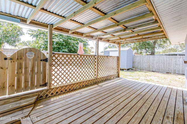 718 6th St, Merritt Island, FL 32953 - wooden deck featuring a gate and a fenced backyard