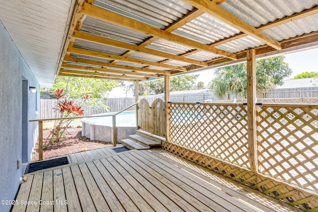718 6th St, Merritt Island, FL 32953 - wooden deck featuring a fenced backyard