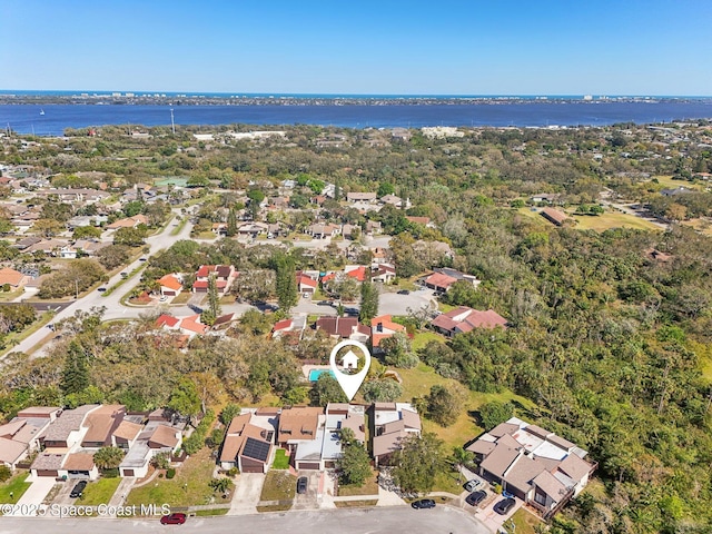 bird's eye view featuring a residential view and a water view