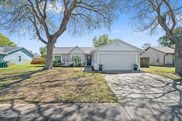 ranch-style home featuring a garage, driveway, a front lawn, and fence